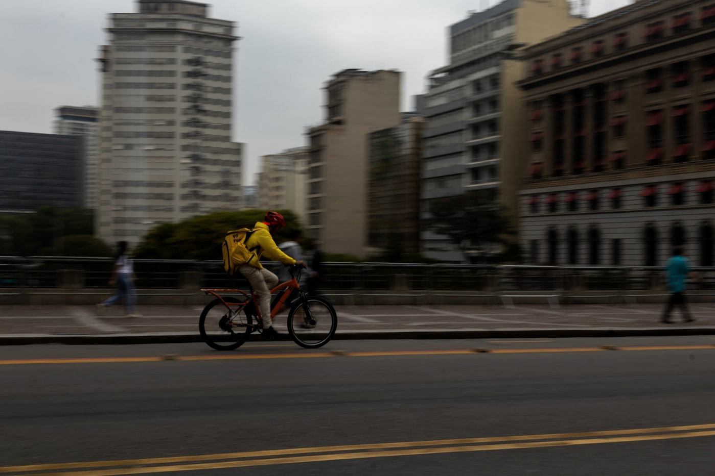 A rider crossing a city street